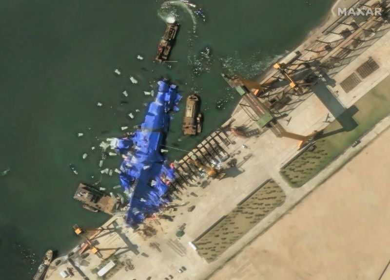 North Korea deploys mystery balloon-like objects to stricken warship, satellite photos show