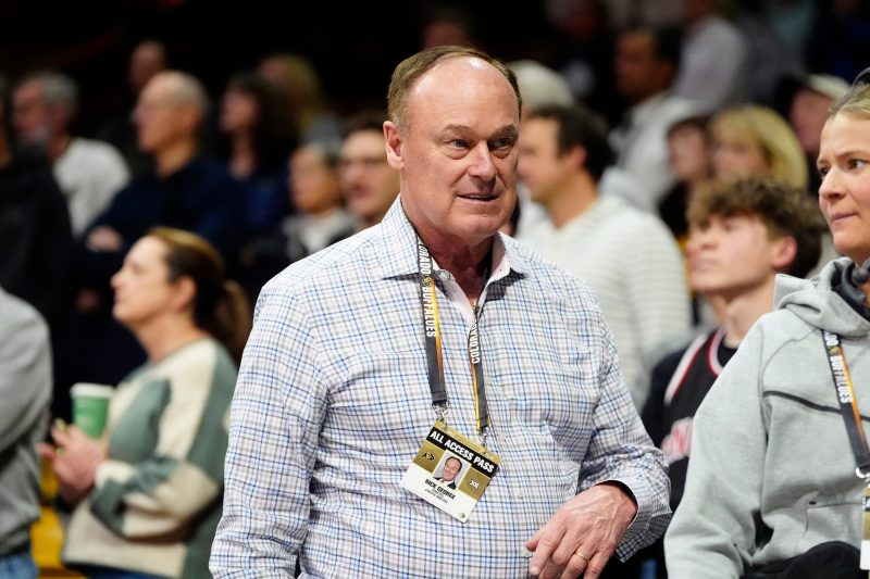 Colorado athletics director who hired Deion Sanders to step down next year